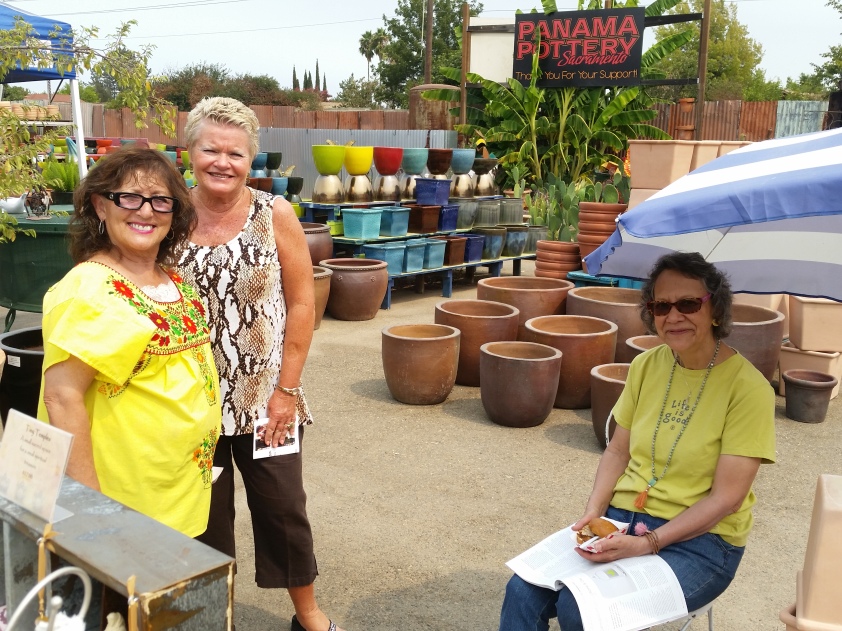Panama Pottery owner Maria Vargas poses with friends and customers on Second Saturday. 